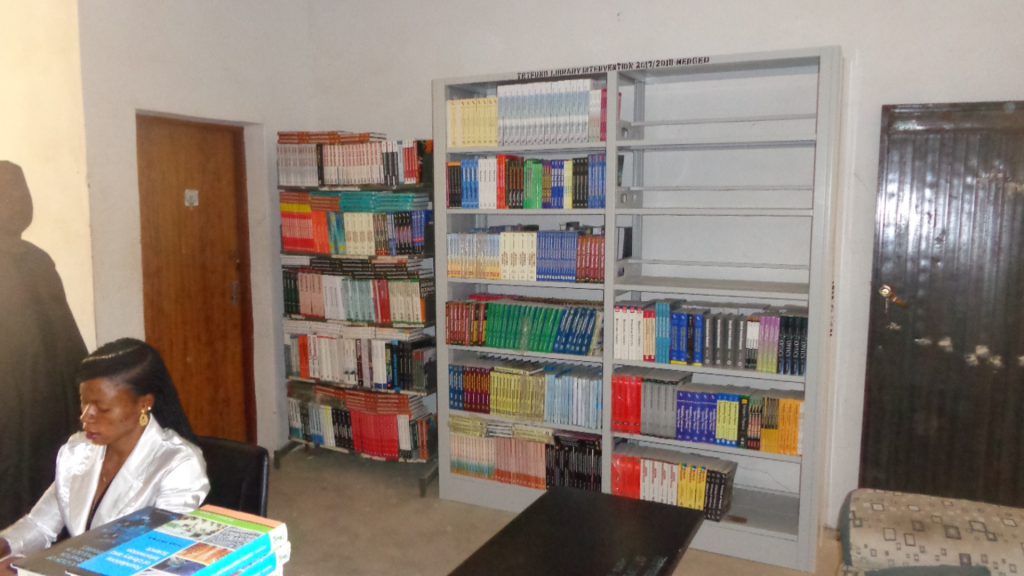 PROCURED TEXTBOOKS ON SHELVES IN COLLEGE LIBRARY